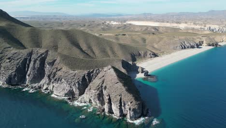 Playa-de-los-Muertos-Beach-in-Cabo-de-Gata,-Andalusia,-Spain---Aerial-4k-Circling