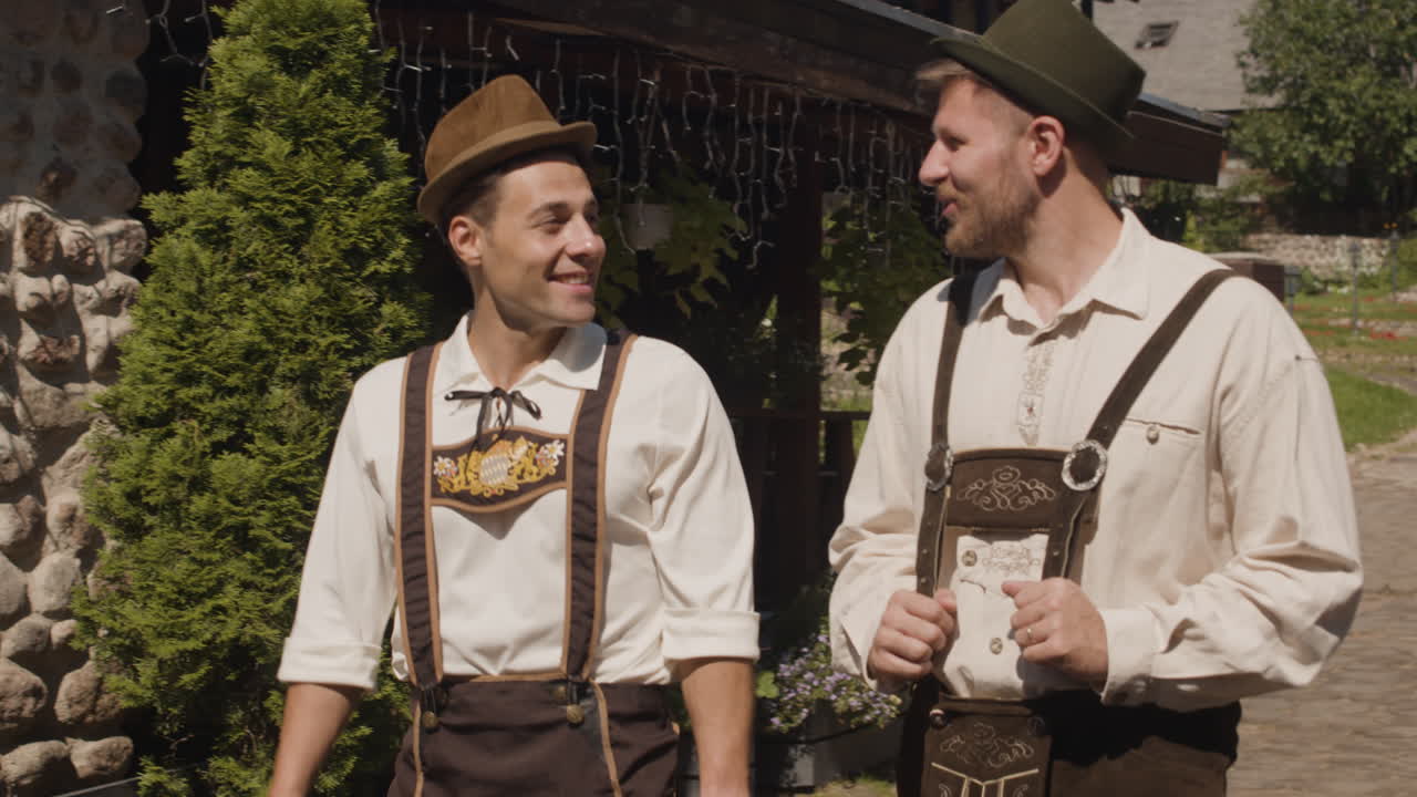 Men in traditional German clothing walking outside