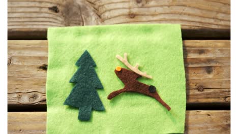 animation of decorations on wooden background at christmas