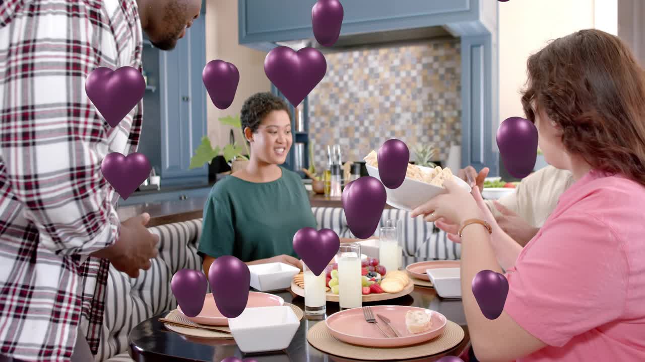 Standing man offering bowl, woman placing food on plate, purple hearts floating over scene, sharing