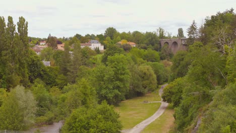 picturesque countryside landscape with stone bridge and river