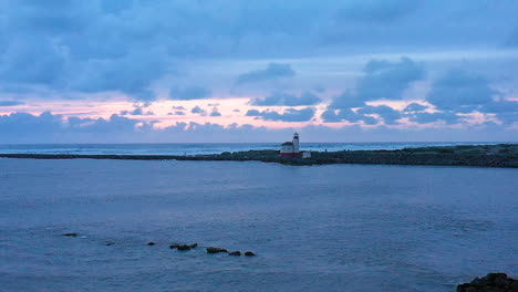 serene and tranquil slow motion footage of drone flying over the coquille river towards the bandon lighthouse, southern oregon