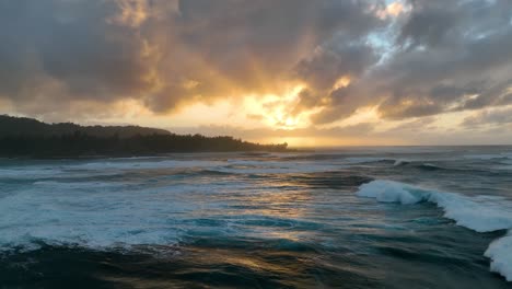 aerial footage from a drone showcases the breathtaking scene of big ocean waves breaking during a golden hour sunset in hawaii