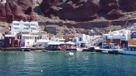 Aerial-View-Of-Ammoudi-Pier-In-Oia-City-On-Santorini-Greece