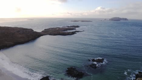 Drone-shot-of-the-ocean-vista-beyond-Bosta-beach,-Great-Bernera-on-the-Outer-Hebrides-of-Scotland