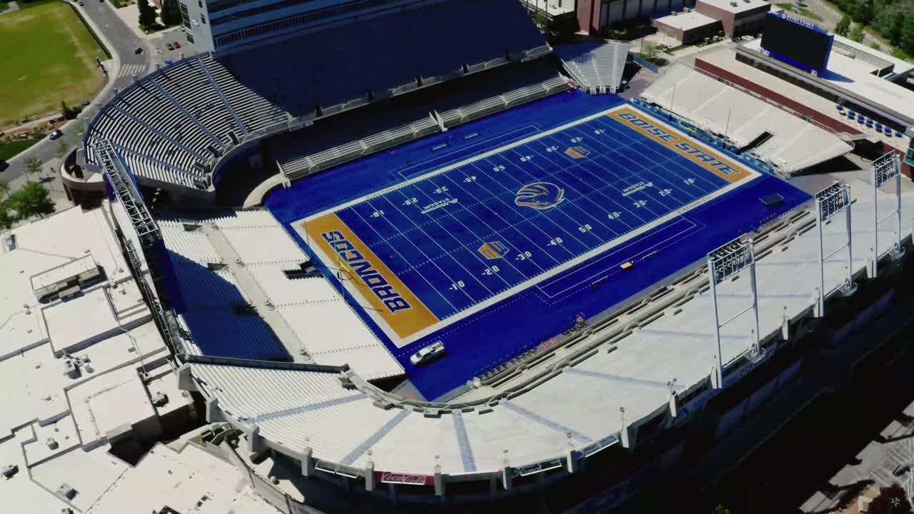 Overhead drone shot of the Boise State Broncos football stadium, empty at midday.