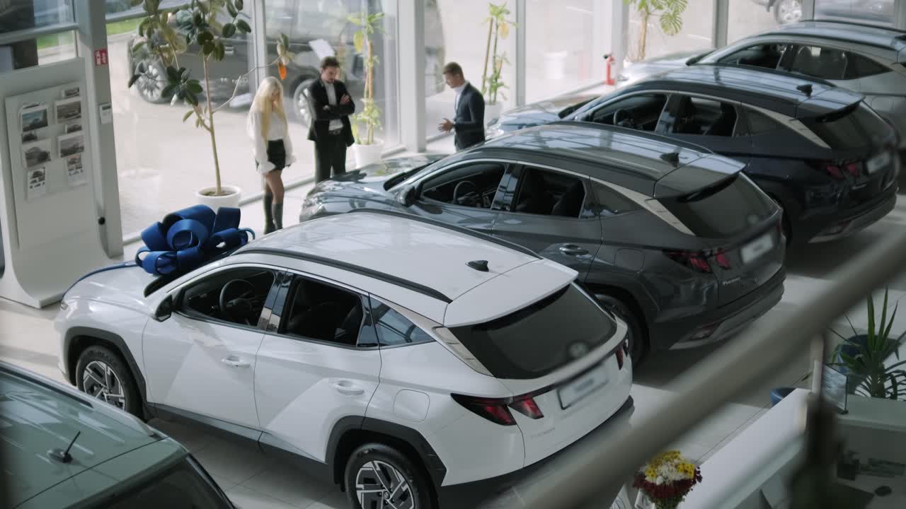 Car Dealership Showroom with Salespeople and Customers
