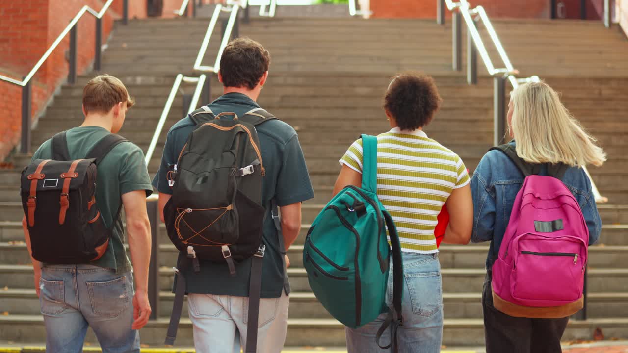 Group of Students Walking Up Stairs on Campus