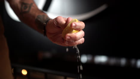 male-latin-tattoo-model-splashing-lime-slow-motion