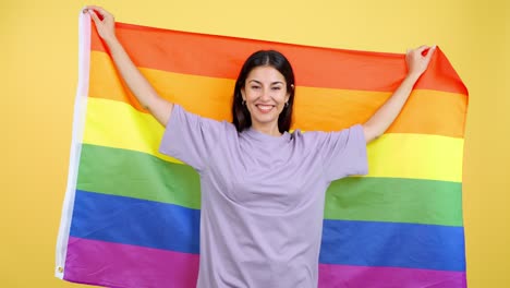 Happy Woman Celebrating with LGBTQ+ Rainbow Flag
