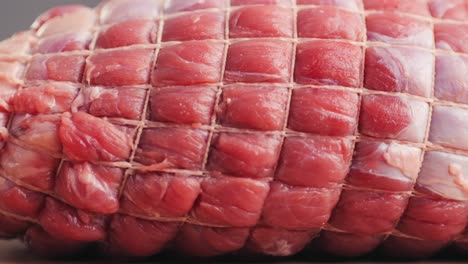 tied raw roast beef
