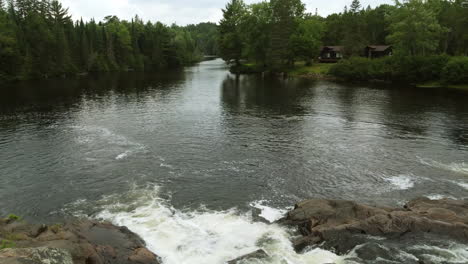 drone flies over the river over algonquin park in ontario