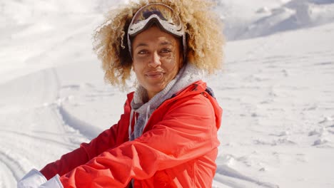 Close-up-of-cheerful-woman-on-snowy-hill