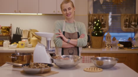 portrait of satisfied housewife in kitchen background she is happy and smiling