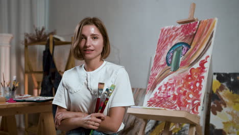 woman posing with brushes