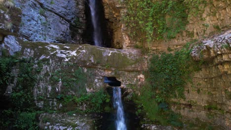 cold water flowing from waterfalls on high rocky mountains of albania