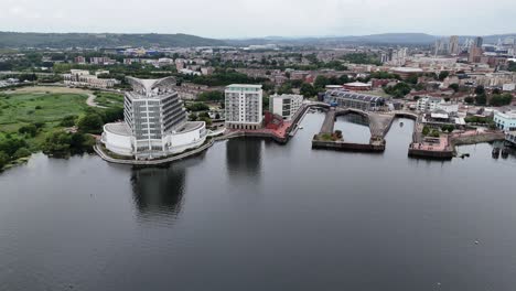 cardiff bay waterfront apartments pull back drone aerial reverse reveal