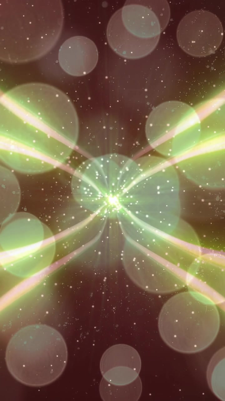 Video verticale: Un nucleo puntiforme emergente invia raggi X verdi pulsanti che generano scintille, per un loop verticale
