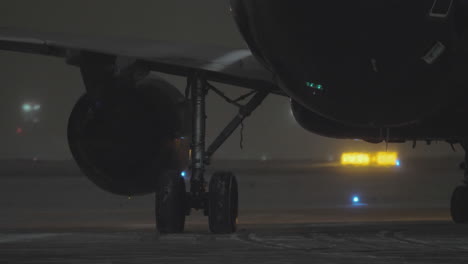 A-closeup-of-a-moving-airplane-engine-and-chassis