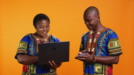 married people doing online shopping on laptop