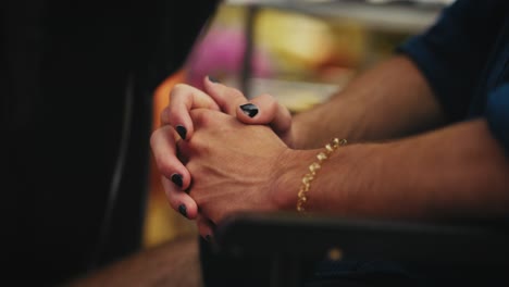 close-up of hands folded together