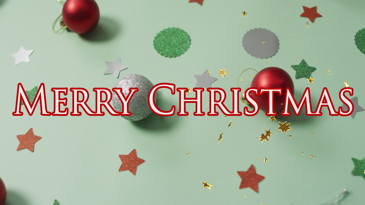 animación de texto de feliz navidad sobre decoraciones en fondo verde claro