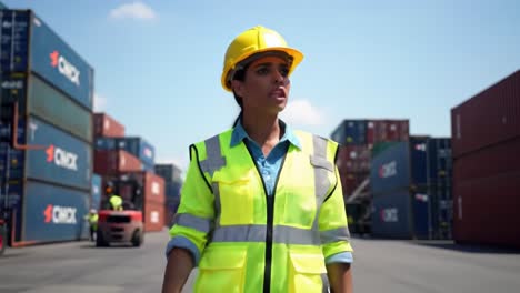 a professional worker conducting operations in a shipping yard surrounded by colorful cargo containers under a bright blue sky, ensuring safety and efficiency in logistics