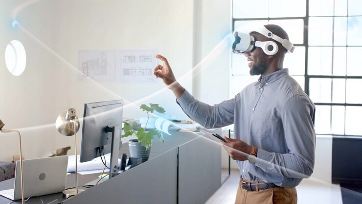Designer touching chin then reaching forward, pinching holographic beams, refining product design