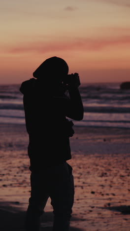 photographer at sunset beach
