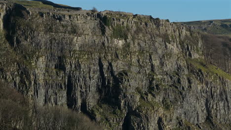 closeup drone shot of steep rocky cliff face near stainforth yorkshire