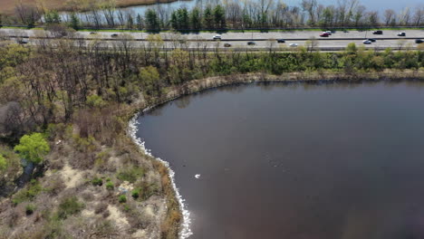 An-aerial-view-over-some-reflective-lakes-during-a-sunny-day