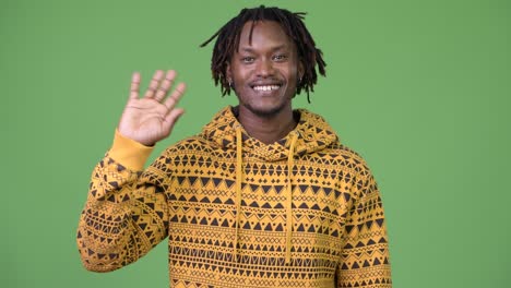 young happy african man waving hand