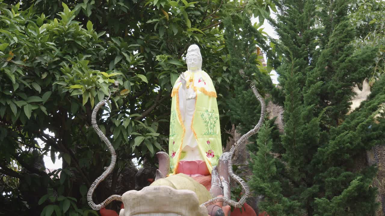 Buddha Standing On Top Of Dragon With Pearl On Its Mouth In Temple In Vietnam
