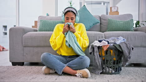 laundry, happy and woman smell clothes