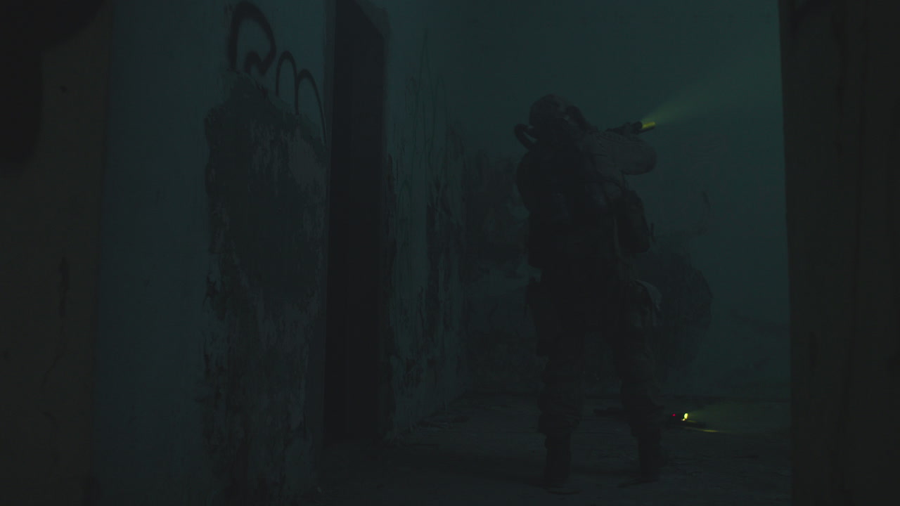 A wounded soldier in the abandoned military complex during the recon mission