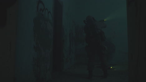 a wounded soldier in the abandoned military complex during the recon mission