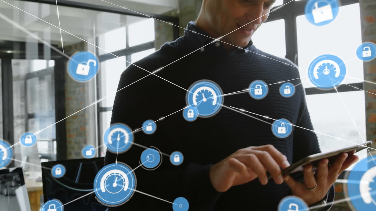 red de iconos digitales contra un empresario caucásico que usa tableta digital en la oficina