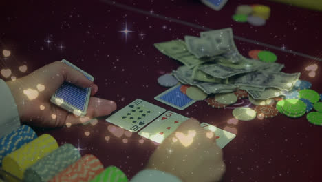 animation of fairy lights over mid section of male croupier distributing cards at casino table