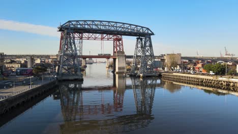 Low-forward-aerial-of-Puente-Transbordador-in-Buenos-Aires,-Argentina