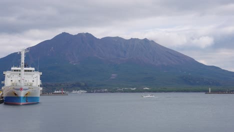 kagoshima bay and harbor, ships and sakura-jima volcano in the background, japan