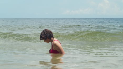 imagine a white sand beach bathed in sunlight, featuring a girl in her youth in a bikini
