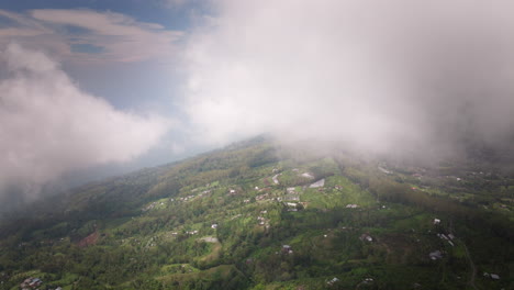 Sunrise-Clouds-Revealed-Mountain-Villages-Near-Steep-Hillside-Of-Mount-Batur-In-Bali,-Indonesia