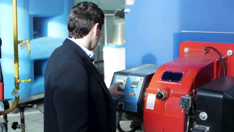 industrial worker operating a boiler