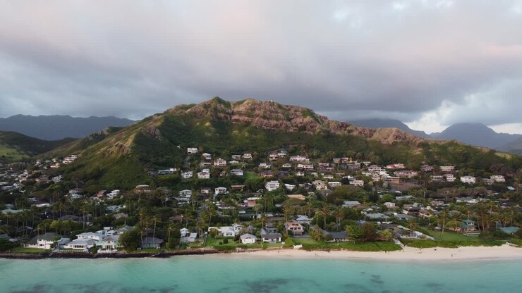 4K cinematic drone shot of Lanikai Beach and the stunning hill that contains the famous Lanikai Pillbox Hike in Oahu