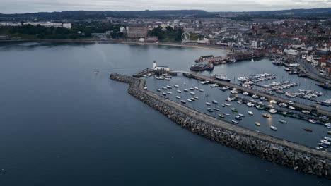 establishing drone shot over scarborough harbour on overcast morning