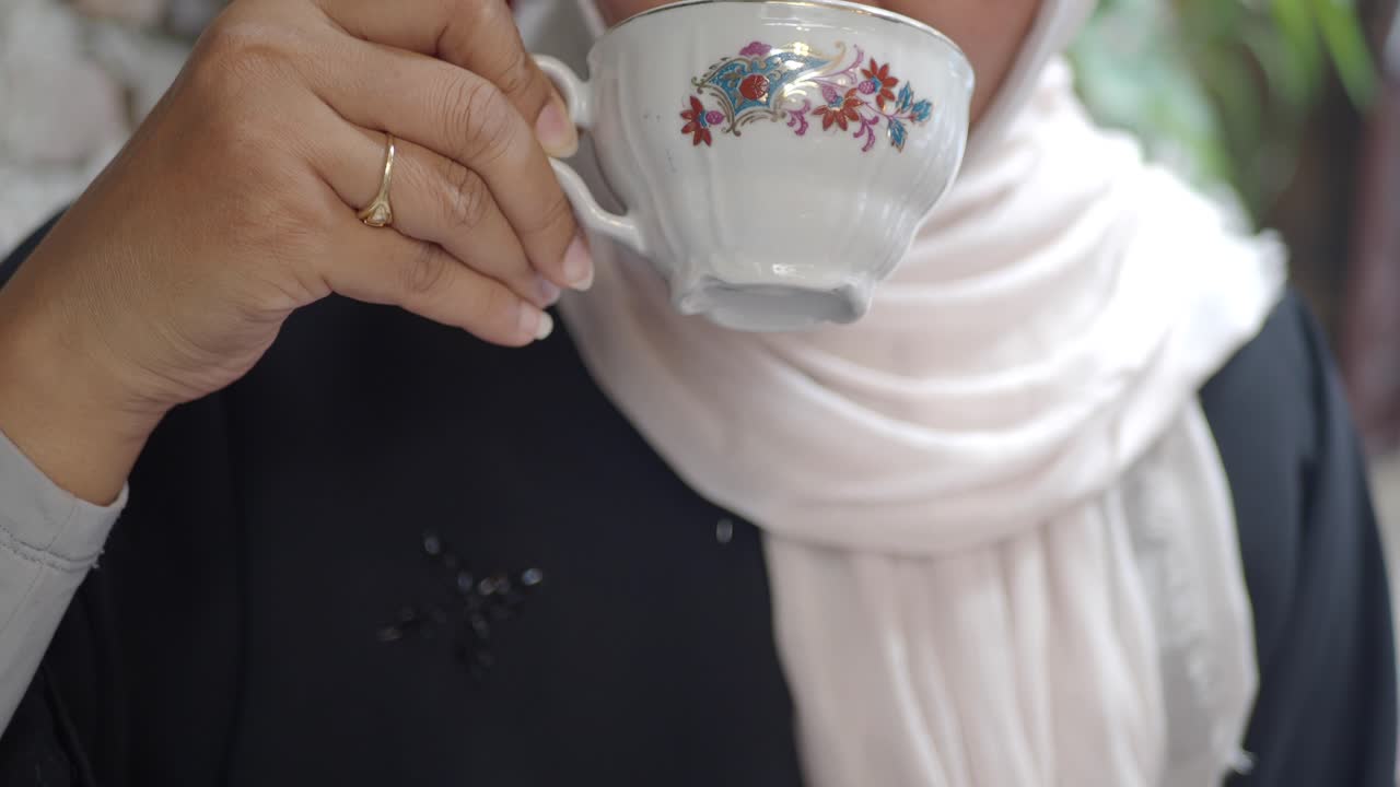 A woman drinking tea