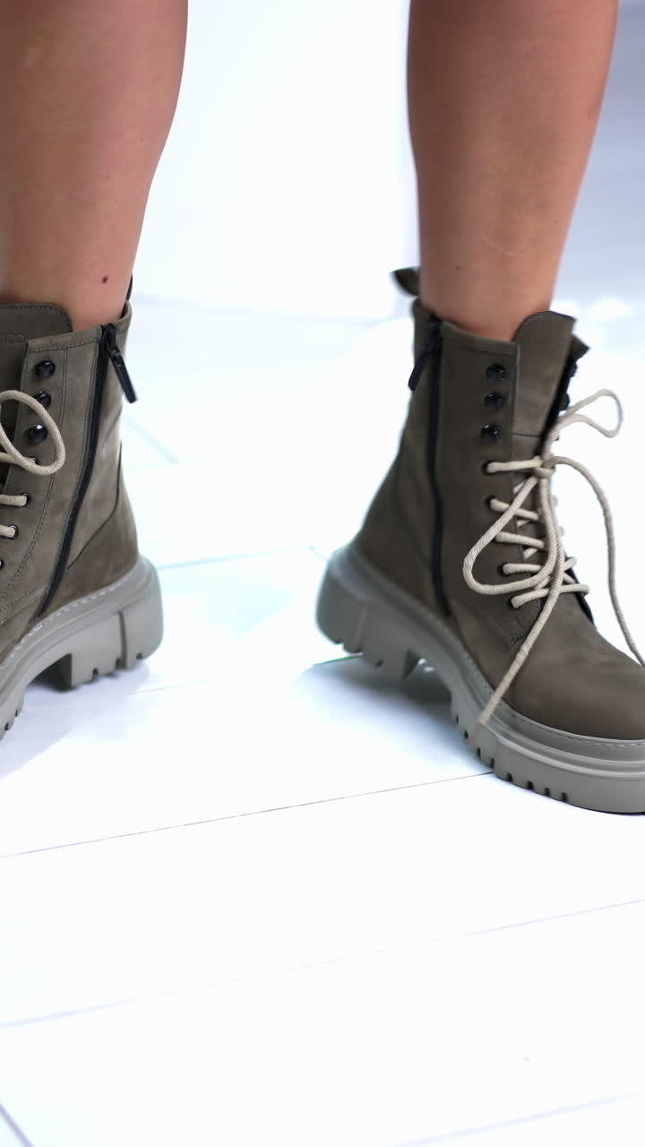 Fit woman legs in fashionable shoes. Footwear lifestyle shoe steps. Vertical video