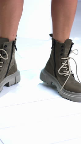 fit woman legs in fashionable shoes. footwear lifestyle shoe steps. vertical video