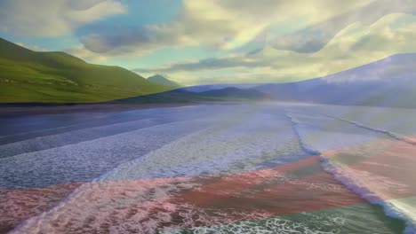 Digital-composition-of-waving-columbia-flag-against-aerial-view-of-sea-waves