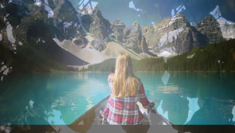 mujer en kayak en un lago